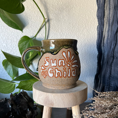#032 Mug-Sun Child Throw and grow ceramics